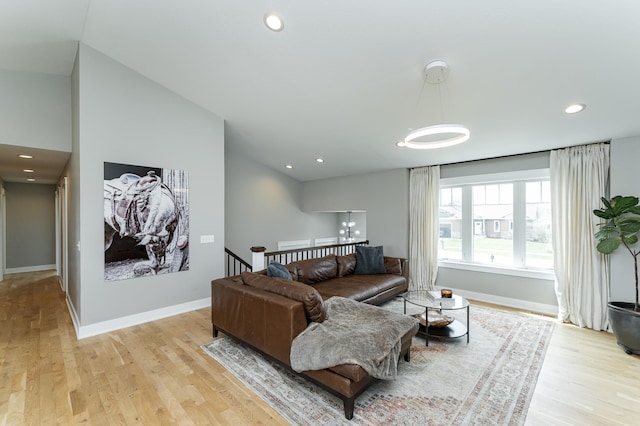 4594 Buckingham Dr NW, Rochester, MN 55901 - living room with light wood-style floors, baseboards, recessed lighting, and lofted ceiling