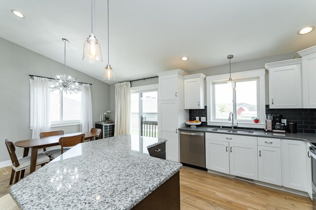 4594 Buckingham Dr NW, Rochester, MN 55901 - kitchen featuring stainless steel dishwasher, a sink, light wood finished floors, a kitchen island, and recessed lighting