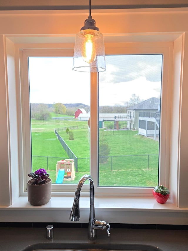 4594 Buckingham Dr NW, Rochester, MN 55901 - kitchen view of a sink and pendant lighting