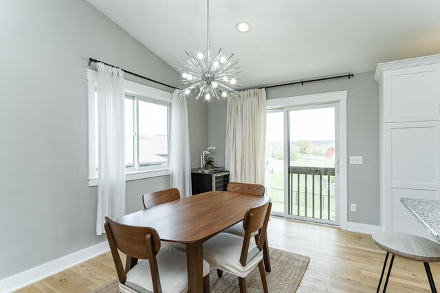 4594 Buckingham Dr NW, Rochester, MN 55901 - dining room with plenty of natural light, a chandelier, light wood finished floors, vaulted ceiling, and recessed lighting