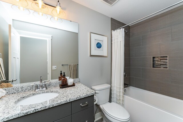 4594 Buckingham Dr NW, Rochester, MN 55901 - bathroom featuring vanity, toilet, and shower / bathtub combination with curtain