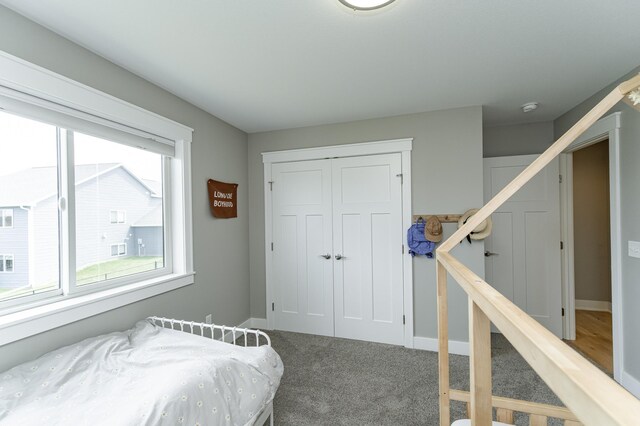 4594 Buckingham Dr NW, Rochester, MN 55901 - carpeted bedroom with a closet and baseboards