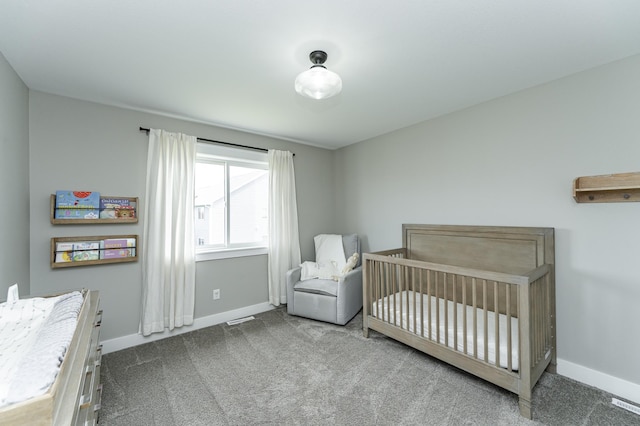 4594 Buckingham Dr NW, Rochester, MN 55901 - bedroom featuring carpet, baseboards, and a nursery area