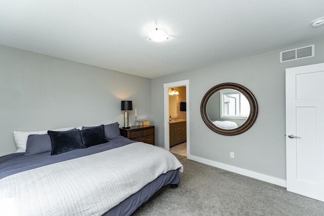 4594 Buckingham Dr NW, Rochester, MN 55901 - bedroom with light carpet, baseboards, and ensuite bathroom