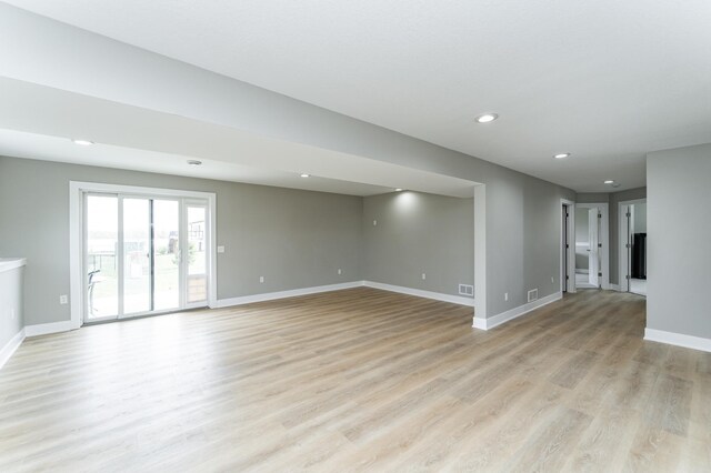 4594 Buckingham Dr NW, Rochester, MN 55901 - spare room featuring recessed lighting, baseboards, and light wood-style flooring