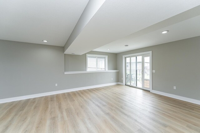 4594 Buckingham Dr NW, Rochester, MN 55901 - unfurnished room featuring light wood finished floors, baseboards, and recessed lighting