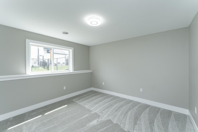 4594 Buckingham Dr NW, Rochester, MN 55901 - empty room featuring carpet and baseboards