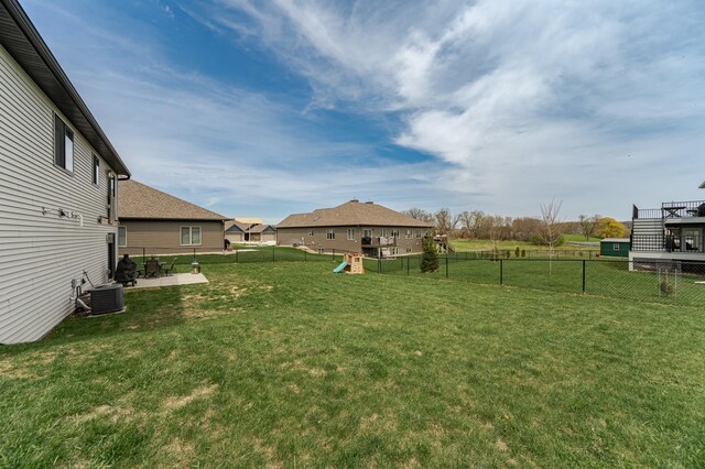4594 Buckingham Dr NW, Rochester, MN 55901 - view of yard with a playground, a patio area, and central air condition unit