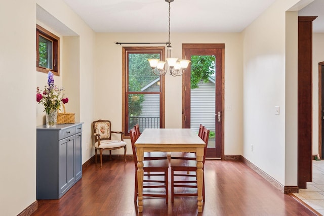 1584 Merrill St, Saint Paul, MN 55108 - dining room with a chandelier and dark wood-type flooring