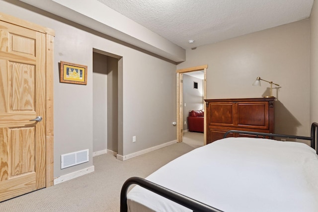 1584 Merrill St, Saint Paul, MN 55108 - bedroom with carpet flooring and a textured ceiling