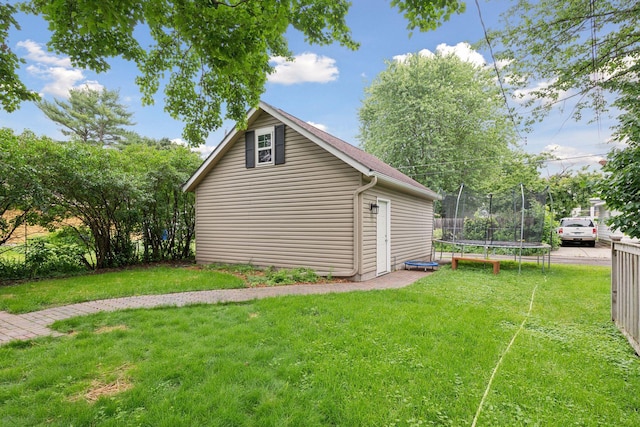1584 Merrill St, Saint Paul, MN 55108 - view of side of property with a trampoline and a yard