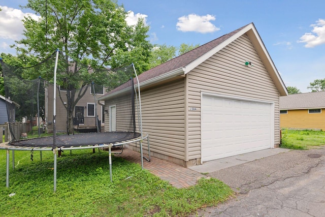 1584 Merrill St, Saint Paul, MN 55108 - detached garage with a trampoline