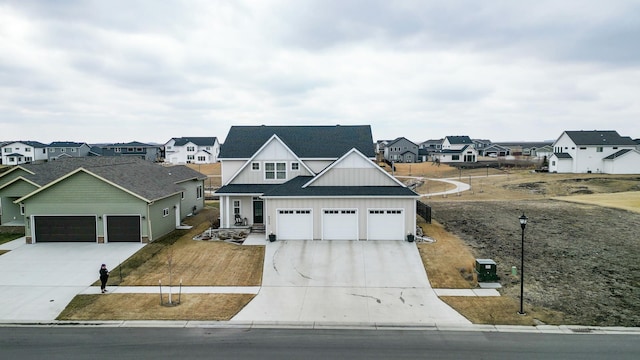 8825 Meadowlark Pkwy, Horace, ND 58047 - view of front of property featuring board and batten siding, roof with shingles, an attached garage, concrete driveway, and a residential view