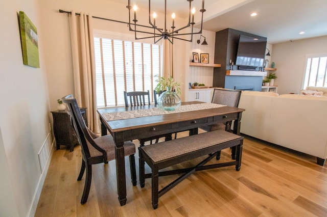 8825 Meadowlark Pkwy, Horace, ND 58047 - dining space with visible vents, light wood finished floors, a chandelier, and recessed lighting