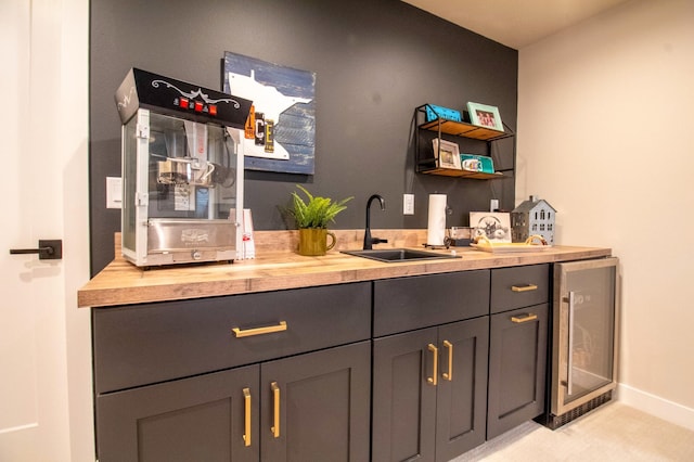 8825 Meadowlark Pkwy, Horace, ND 58047 - bar with wine cooler, a sink, and baseboards