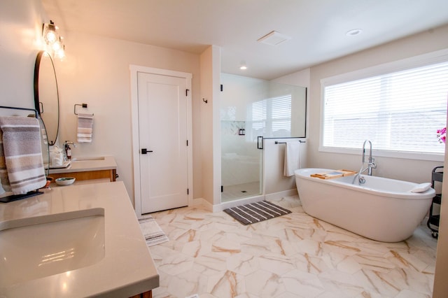 8825 Meadowlark Pkwy, Horace, ND 58047 - full bath featuring a shower stall, vanity, marble finish floor, and a freestanding bath