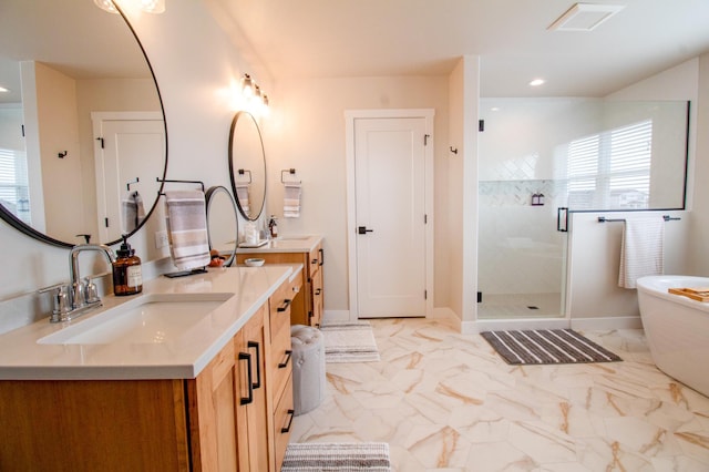 8825 Meadowlark Pkwy, Horace, ND 58047 - bathroom featuring a stall shower, a soaking tub, a sink, and plenty of natural light