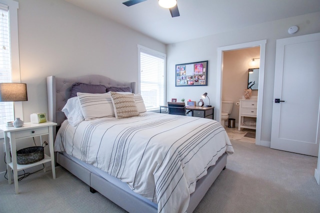 8825 Meadowlark Pkwy, Horace, ND 58047 - bedroom featuring ensuite bath, light colored carpet, and a ceiling fan