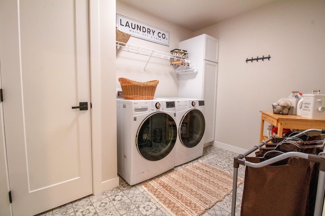8825 Meadowlark Pkwy, Horace, ND 58047 - washroom featuring cabinet space, baseboards, and washer and dryer
