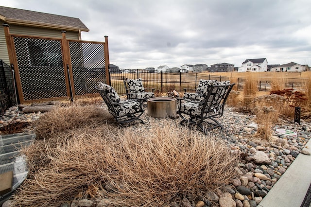 8825 Meadowlark Pkwy, Horace, ND 58047 - view of yard featuring an outdoor fire pit and fence