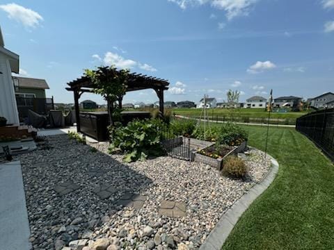 8825 Meadowlark Pkwy, Horace, ND 58047 - view of yard with a pergola, fence, and a vegetable garden