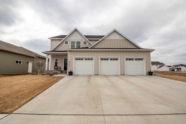 8825 Meadowlark Pkwy, Horace, ND 58047 - craftsman-style house with a porch, driveway, board and batten siding, and an attached garage