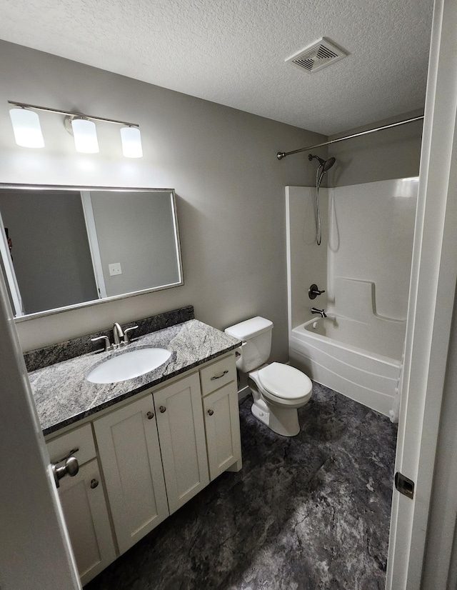 bathroom featuring toilet, a textured ceiling, visible vents, and vanity