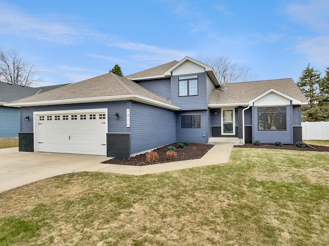 7426 Chesham Ln, Woodbury, MN 55125 - traditional-style house featuring driveway, a front lawn, a garage, fence, and a shingled roof