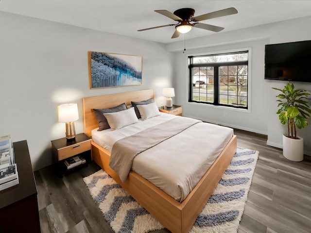 7426 Chesham Ln, Woodbury, MN 55125 - bedroom featuring baseboards, a ceiling fan, and wood finished floors