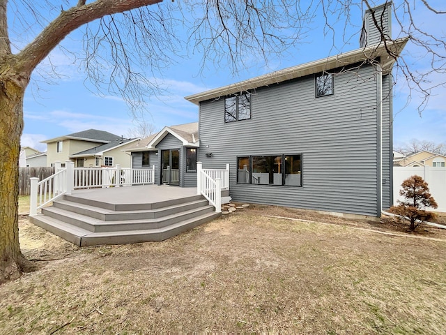 7426 Chesham Ln, Woodbury, MN 55125 - back of property with fence and a wooden deck