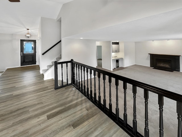 7426 Chesham Ln, Woodbury, MN 55125 - interior space with wood finished floors, a fireplace, baseboards, and stairway
