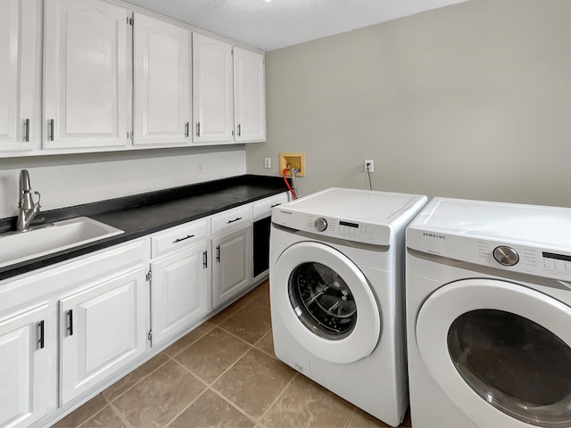 7426 Chesham Ln, Woodbury, MN 55125 - laundry area with separate washer and dryer, light tile patterned floors, a sink, and cabinet space