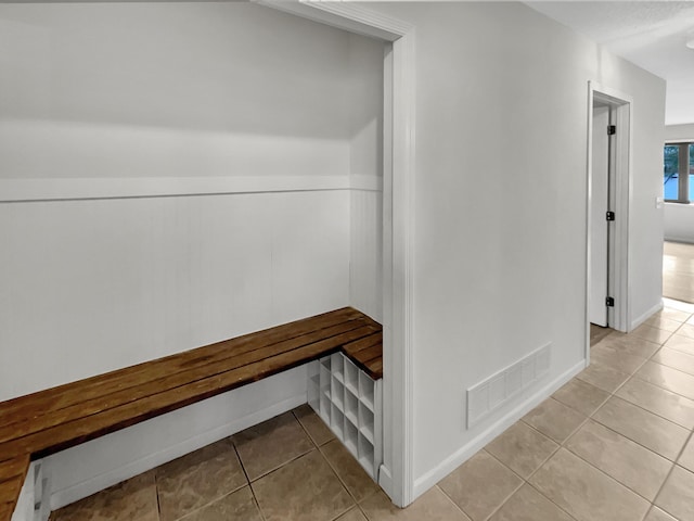 7426 Chesham Ln, Woodbury, MN 55125 - corridor with light tile patterned floors and visible vents