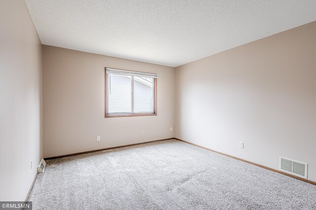 5401 70th Cir N, Brooklyn Center, MN 55429 - empty room featuring carpet and a textured ceiling