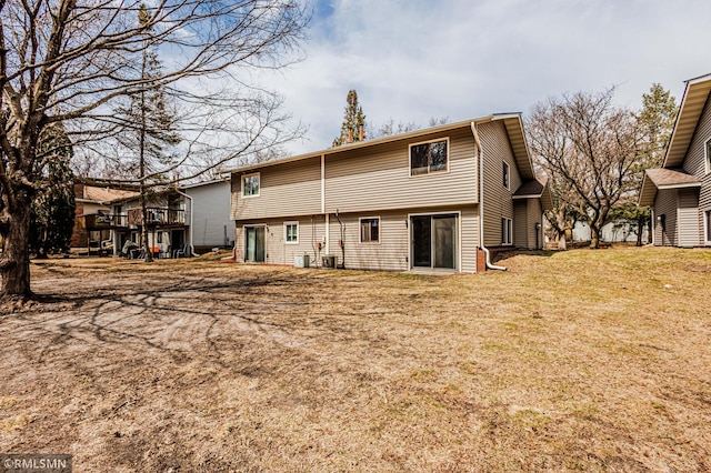 5401 70th Cir N, Brooklyn Center, MN 55429 - back of property with a yard and a wooden deck