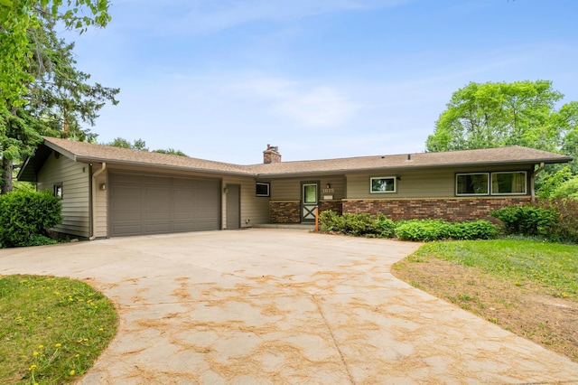 1615 2nd St N, Stillwater, MN 55082 - single story home featuring an attached garage, driveway, and a chimney