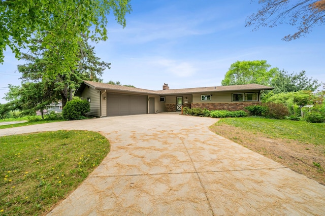 1615 2nd St N, Stillwater, MN 55082 - ranch-style house featuring concrete driveway, a garage, a chimney, a front yard, and stone siding