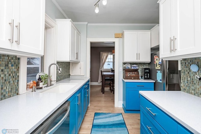 kitchen with white cabinets, blue cabinets, and dishwasher