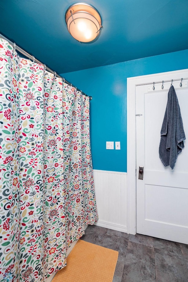 bathroom featuring a wainscoted wall