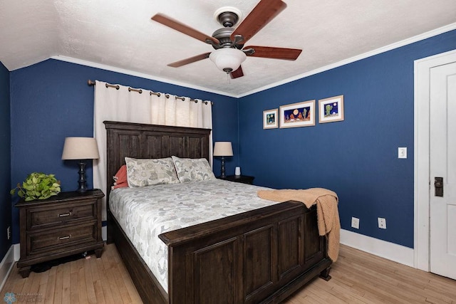 bedroom featuring baseboards, light wood-style flooring, and ceiling fan
