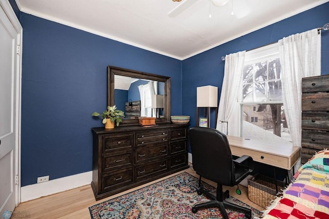 office area with crown molding, baseboards, ceiling fan, and wood finished floors