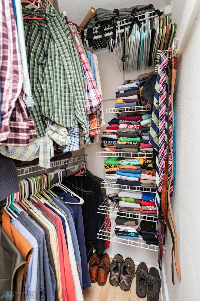 spacious closet featuring wood finished floors