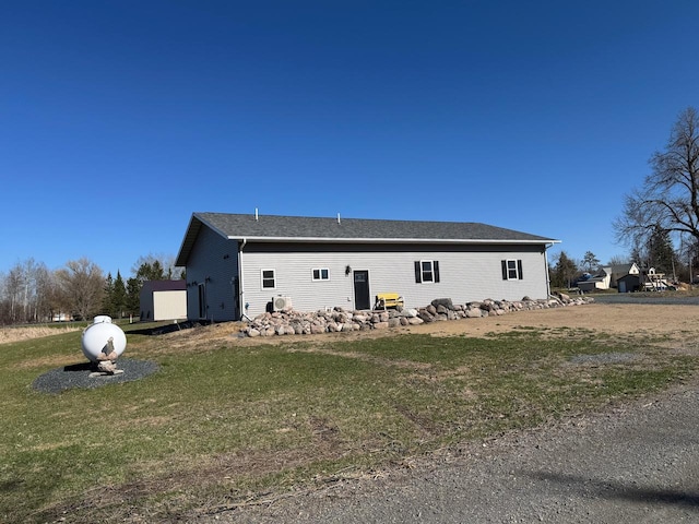 504 Lakin Ave NW, Kelliher, MN 56650 - view of property exterior with a yard