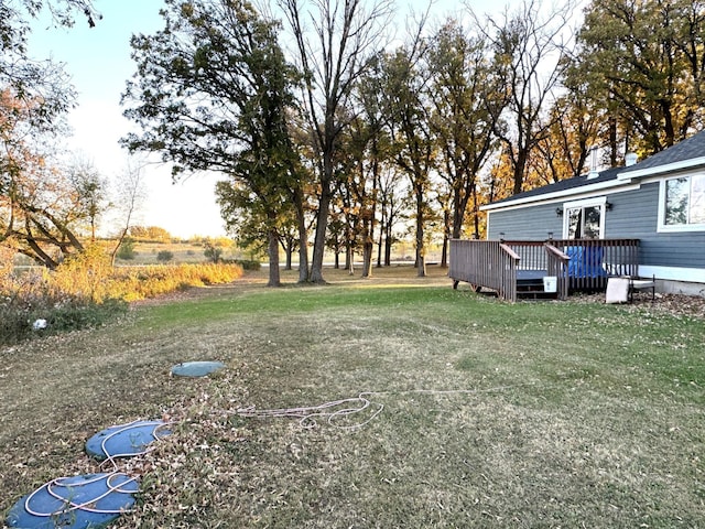 view of yard with a wooden deck