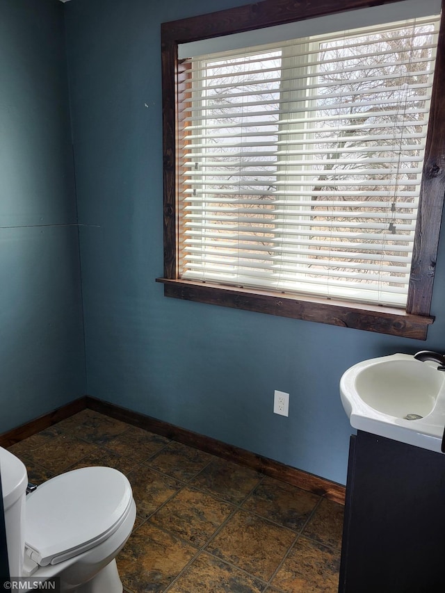 12972 Big Kandi Dr, Lake Lillian, MN 56253 - bathroom with toilet, vanity, and baseboards