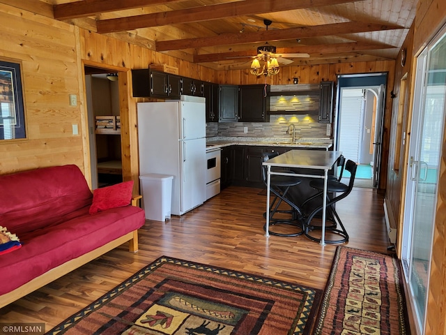 12972 Big Kandi Dr, Lake Lillian, MN 56253 - kitchen featuring light countertops, wooden walls, dark wood finished floors, and white appliances