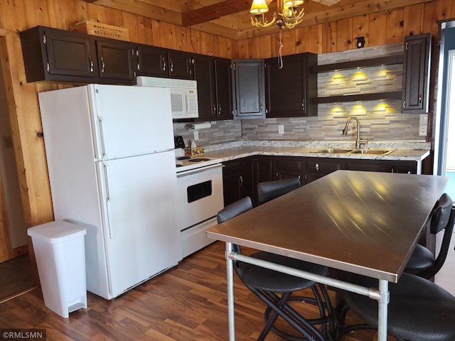 12972 Big Kandi Dr, Lake Lillian, MN 56253 - kitchen with backsplash, wooden walls, a sink, and white appliances
