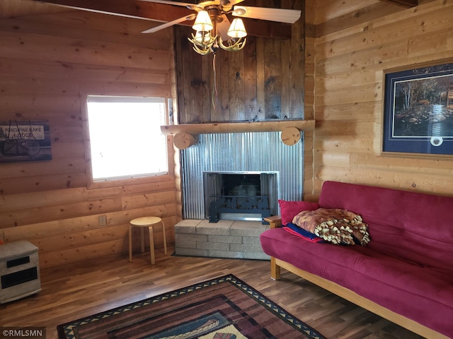 12972 Big Kandi Dr, Lake Lillian, MN 56253 - living area featuring wood finished floors, wood walls, and ceiling fan