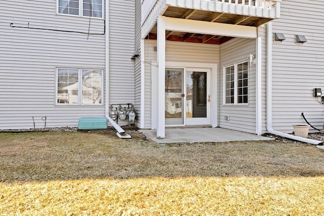 doorway to property featuring a yard