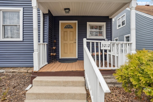 doorway to property with covered porch